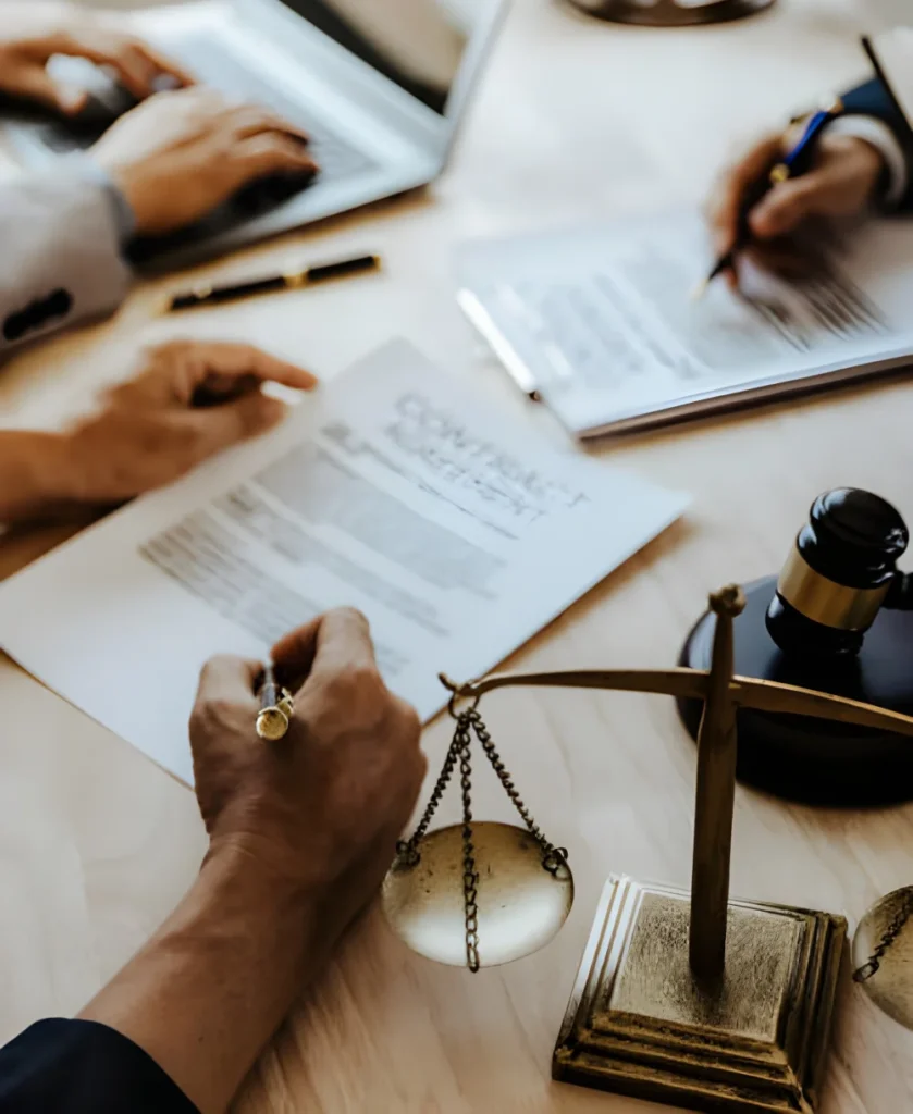 Legal documents and scales of justice for business litigation law suit